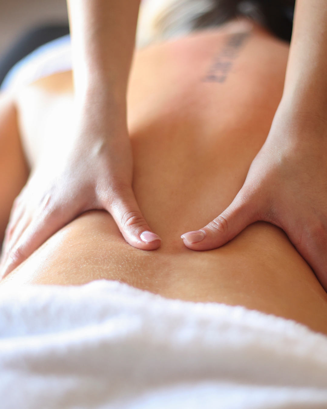 Certified massage therapist performing lymphatic drainage treatment at Bella Santé Spa in Boston