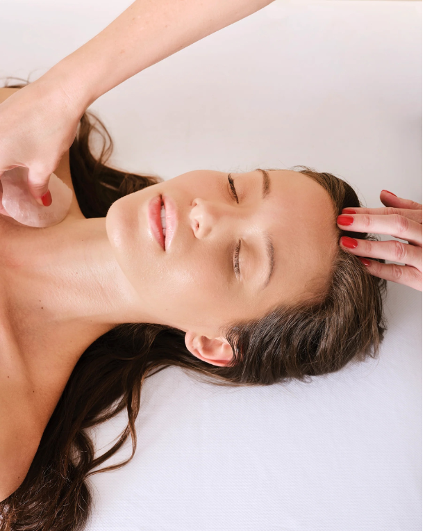 Woman receiving a professional facial treatment at Bella Santé Spa in Boston, Lexington, and Wellesley