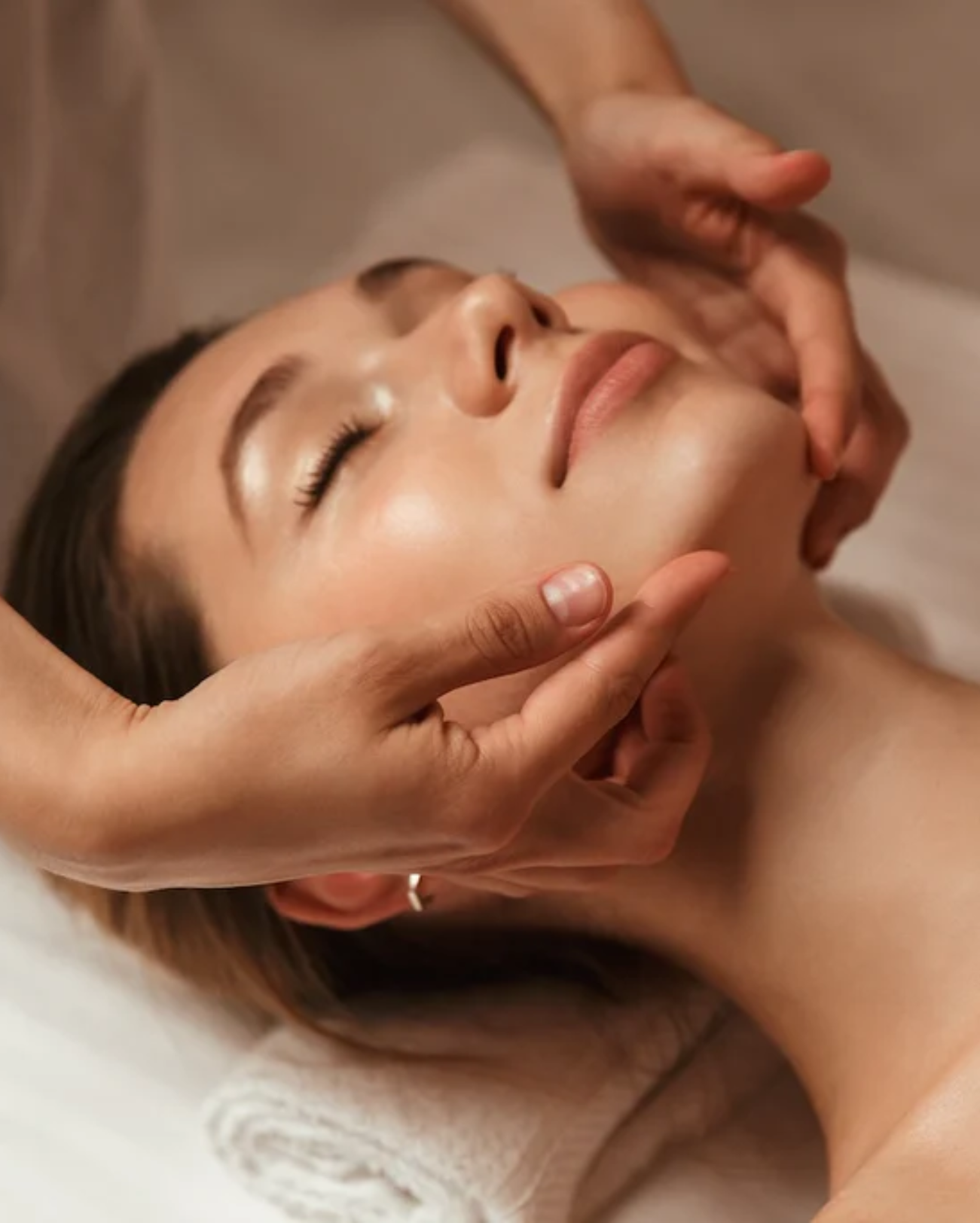 Licensed aesthetician performing custom facial at Bella Santé skin care clinic in Boston