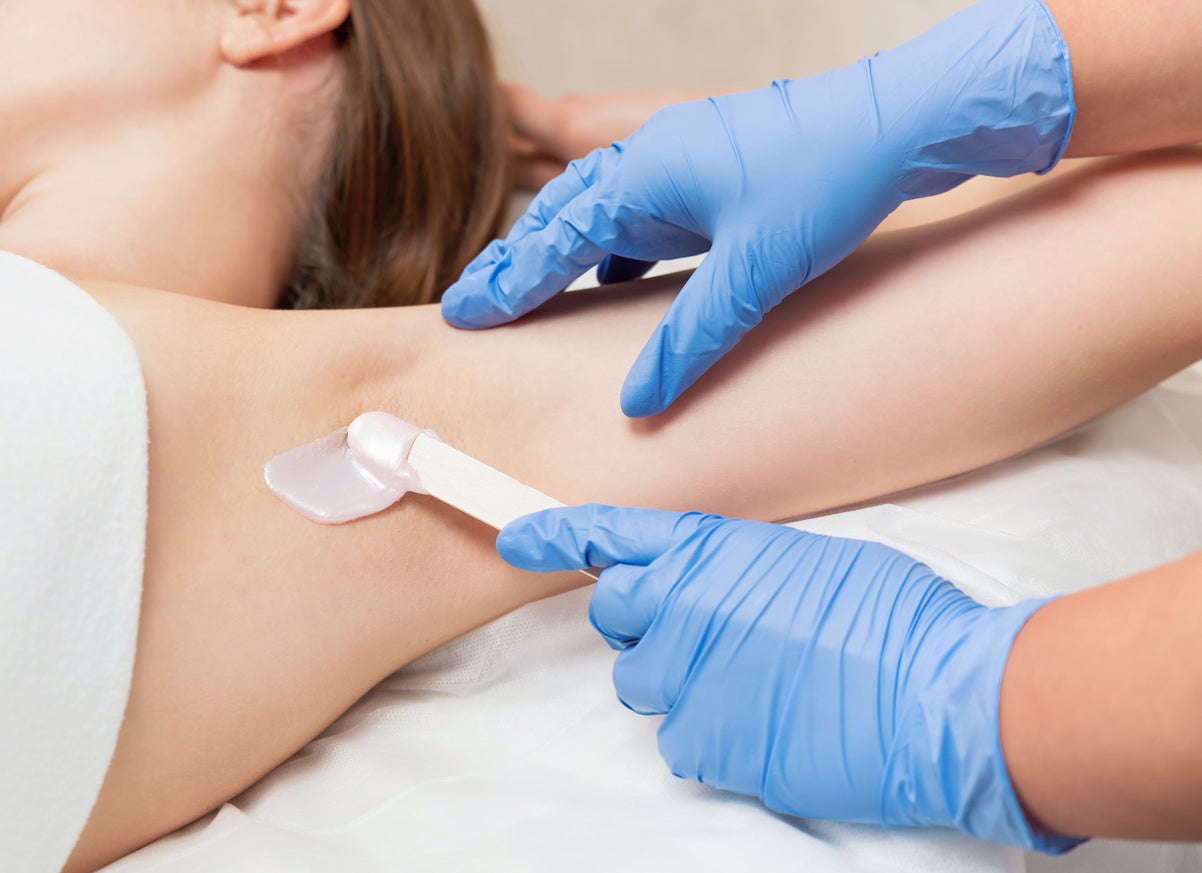 Woman receiving professional waxing at Bella Santé Spa in Boston, Lexington, and Wellesley