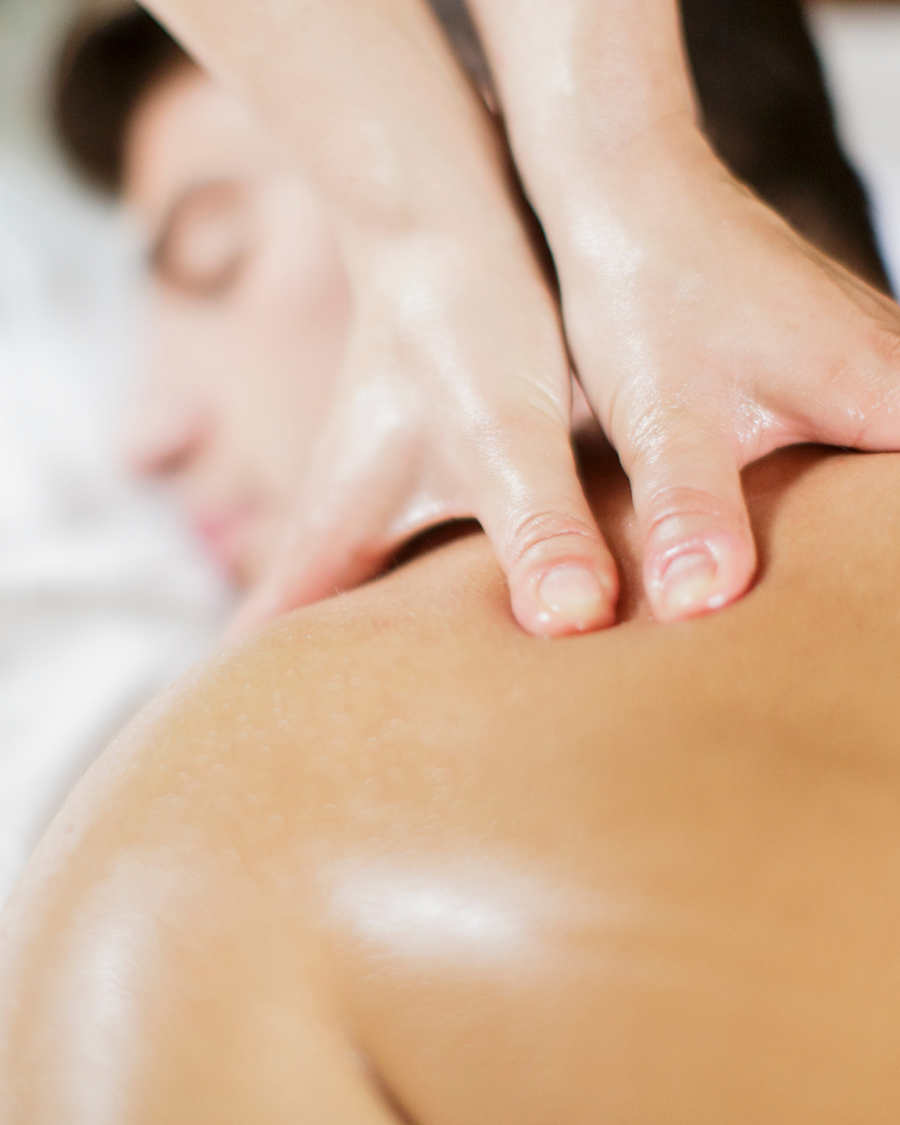 Man receiving a massage from his partner.