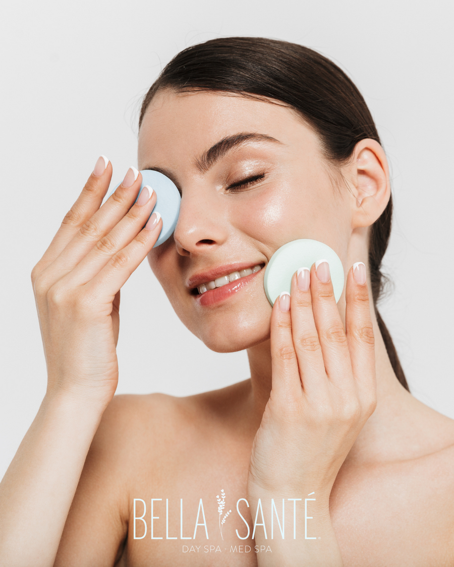 Woman soothing her sunburn with skin care products.