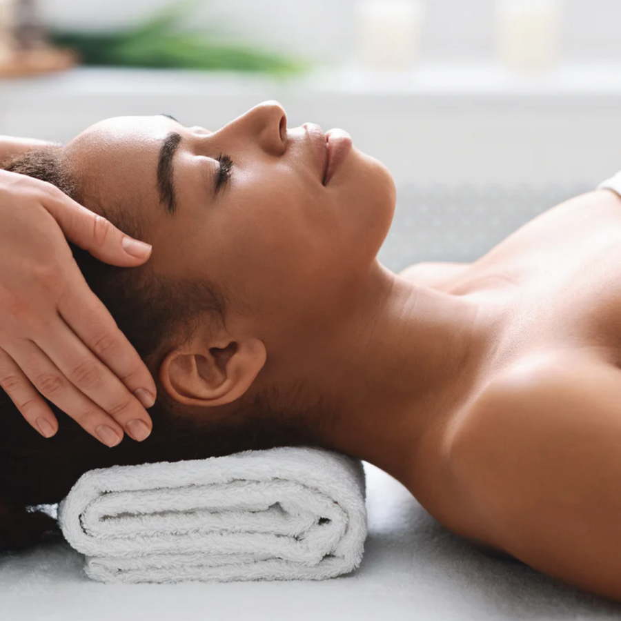 Woman with deeper skin tone preparing for a MOXI laser treatment at Bella Santé