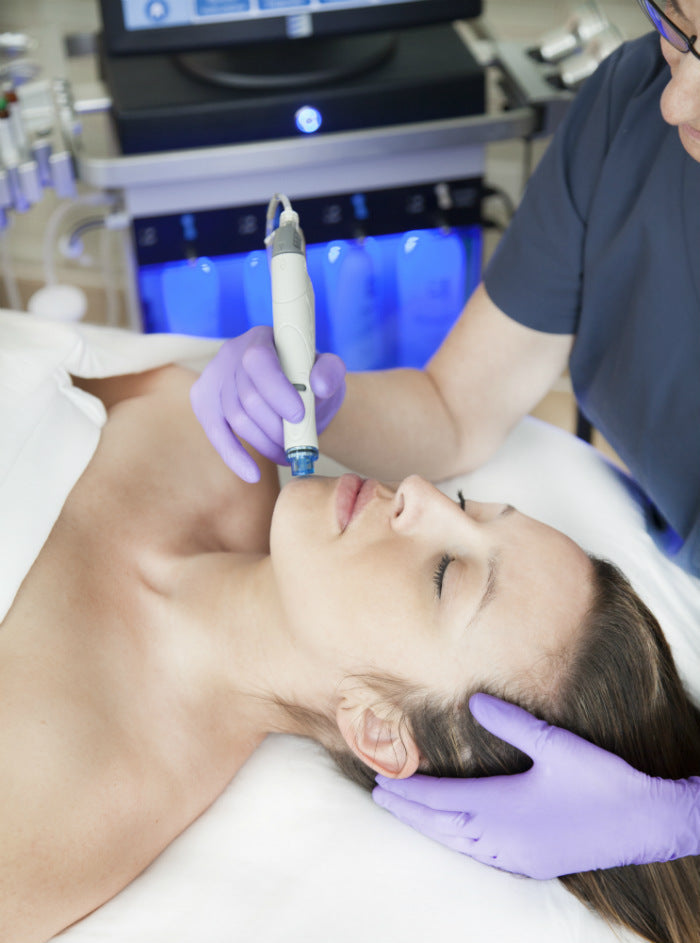 Woman receiving a HydraFacial at Bella Sante