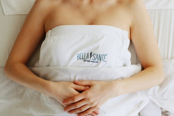 Image of A Woman At A Luxury Spa In Boston, Lexington and Wellesley Massachusetts on A Massage Table