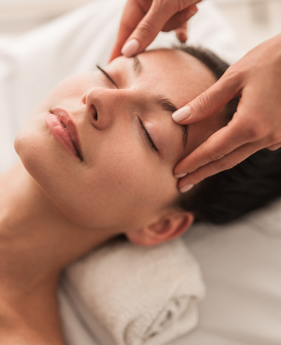 Woman receiving facial customized for sensitive skin at Bella Sante Luxury