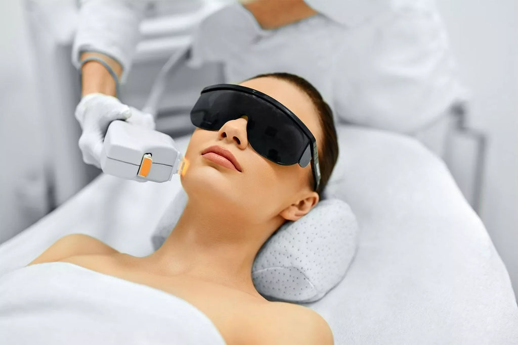 Woman receiving non-surgical procedure for skin tightening in med spa 