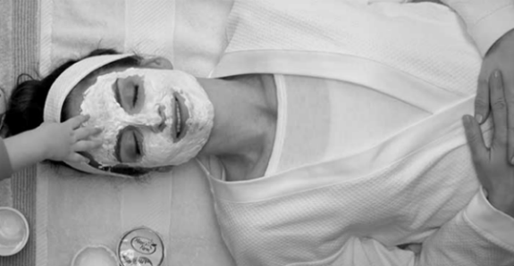 Woman enjoying a facial at home instead of at the spa