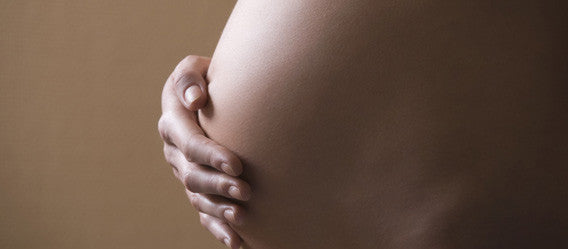 Expectant mother with visible pregnant belly