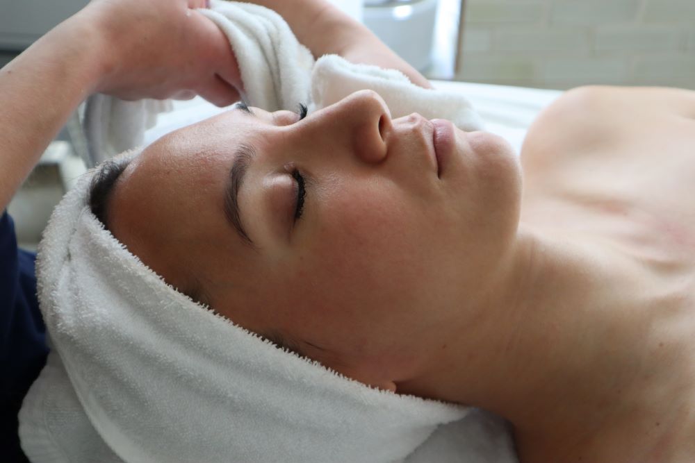 Woman getting micro-needling treatment at Bella Santé Spa