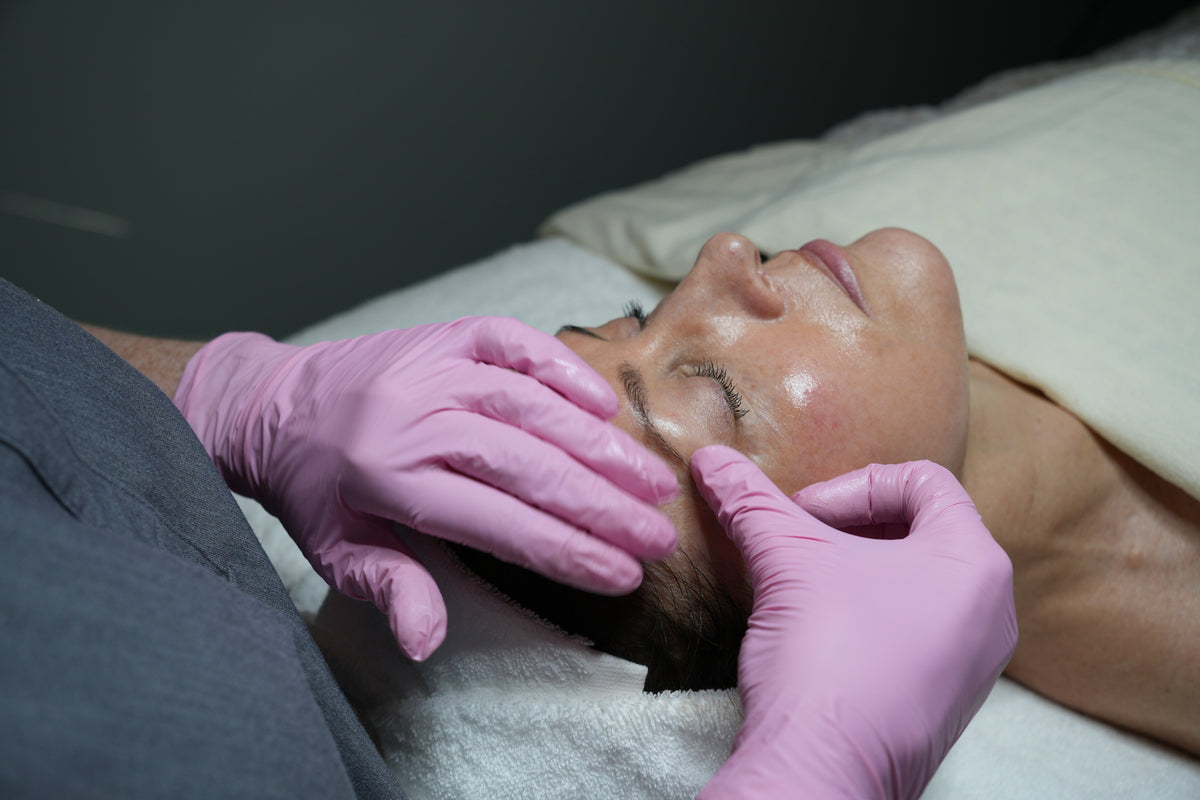 Guest receiving a PRX treatment with a towel on their head in a spa setting at Bella Sante in Boston