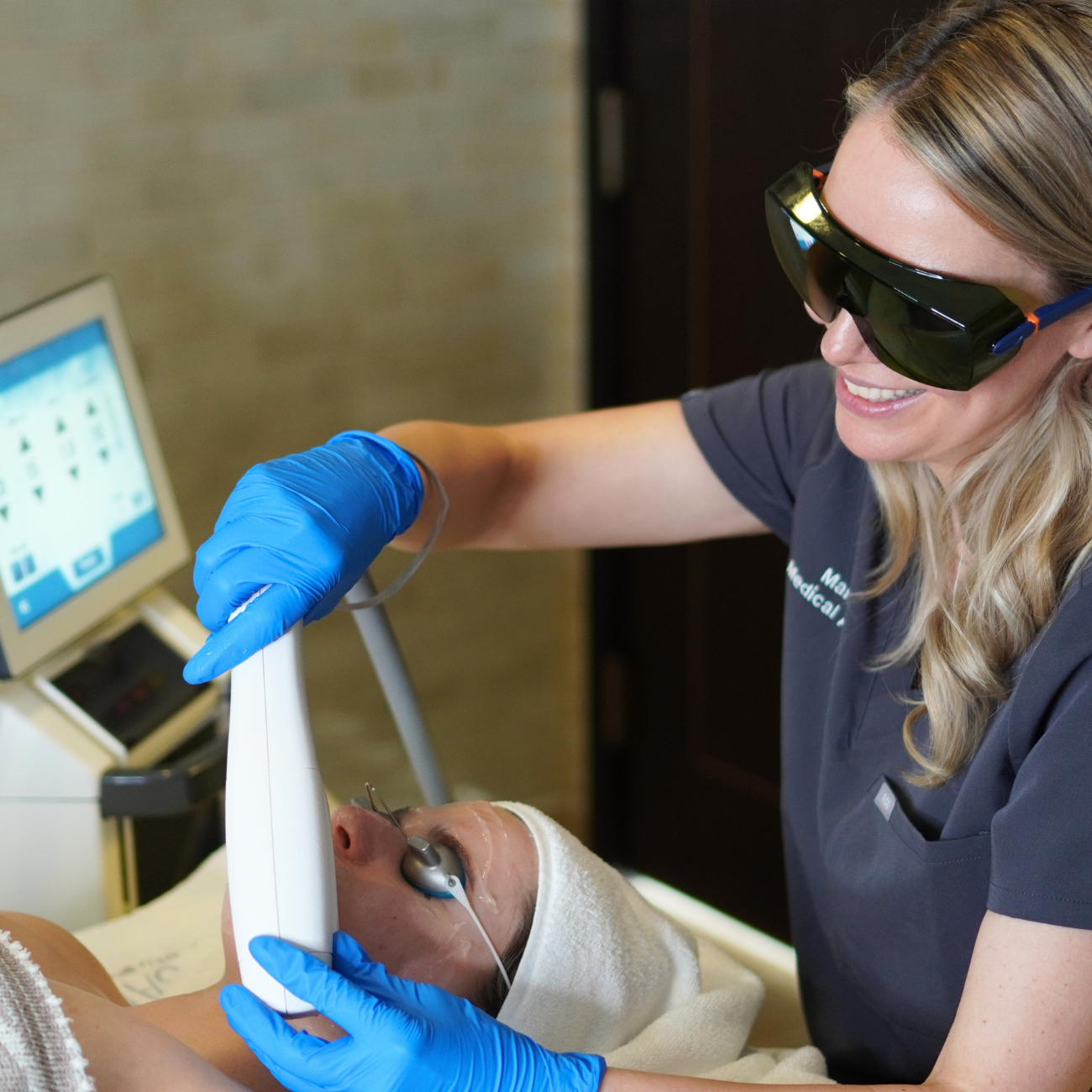 Licensed esthetician performing IPL facial with Sciton BBL technology